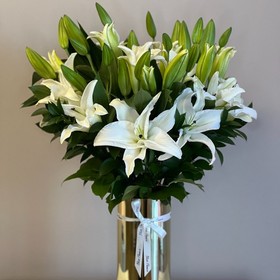 White lilies in a gold vase